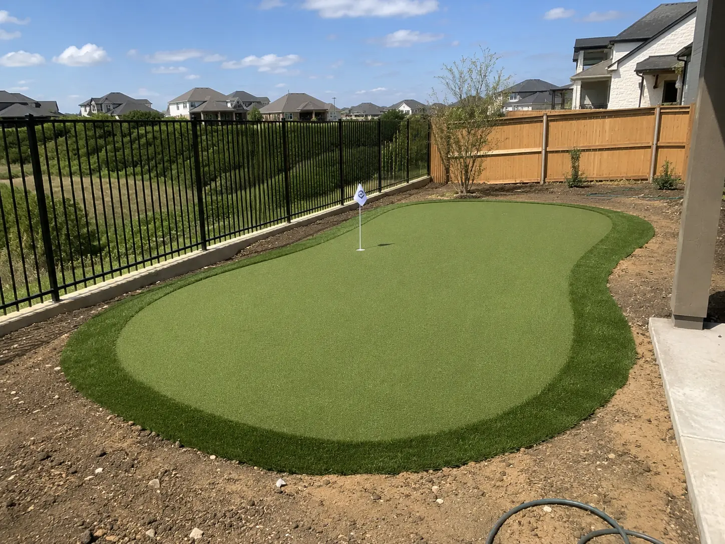 Custom backyard putting green installation in Celina TX by Medina Landscape